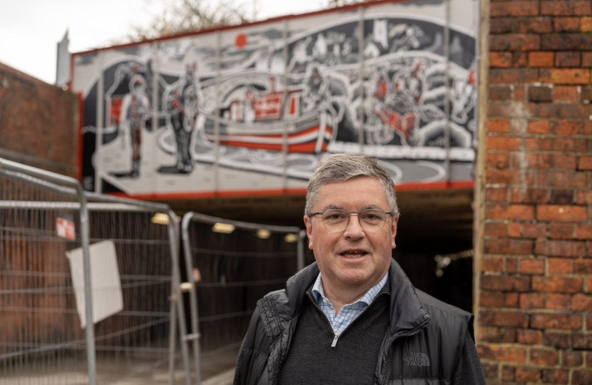 Sir Robert Buckland MP with the new Conservative Government Funded  mural showcasing Swindon’s canal history 