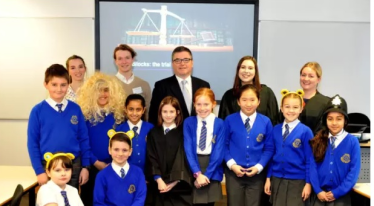Solicitor General Robert Buckland visits children at Adel Primary School in Leeds