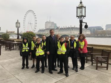 Robert Buckland MP pictured with Year 6 pupils at Peatmoor Community Primary School during their visit to Parliament